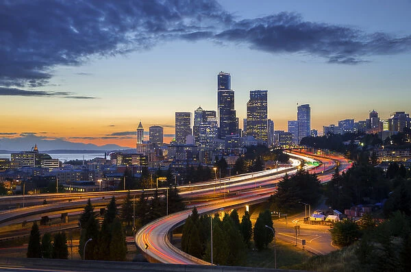 USA, Washington State, Seattle. Sunset view of downtown over I-5 from the Jose Rizal Bridge