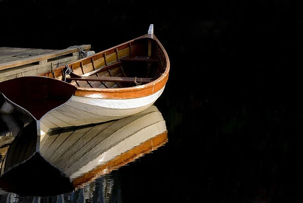 USA, Washington State, Seattle. Wooden boat reflects on lake