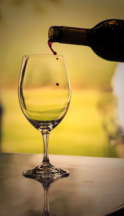 Framed Print : USA, Washington State, Walla Walla. Red wine backlit by the mid-day sun poured into wine