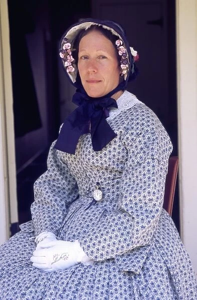 USA, Washington, Tacoma. Portrait of woman re-enacter in 1850s period dress & bonnet