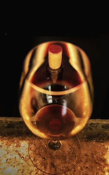 USA, Washington, Walla Walla. The illusion of a bottle inside a glass in a Walla