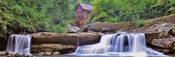 USA, West Virginia, Babcock SP. Two waterfalls form the foreground for Glade Creek Grist Mill