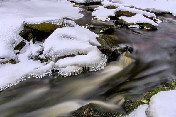 USA, West Virginia, Blackwater Falls State Park. Flowing winter stream. Credit as