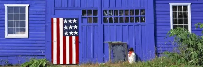 Framed Print : USA, Wisconsin, Kewaunee Co. A stylized American flag decorates a door on this blue
