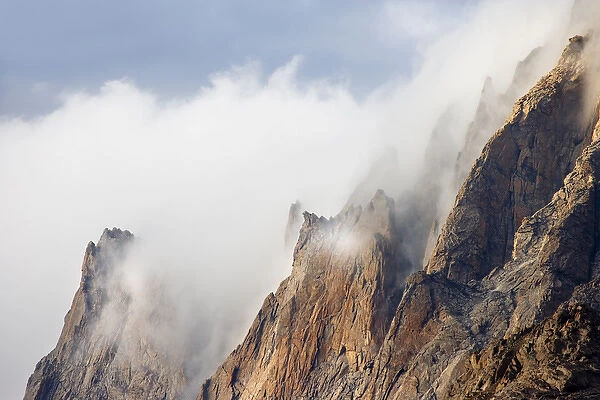 USA, Wyoming, Bridger National Forest. A cloud-covered, jagged peak in the Bridger Wilderness