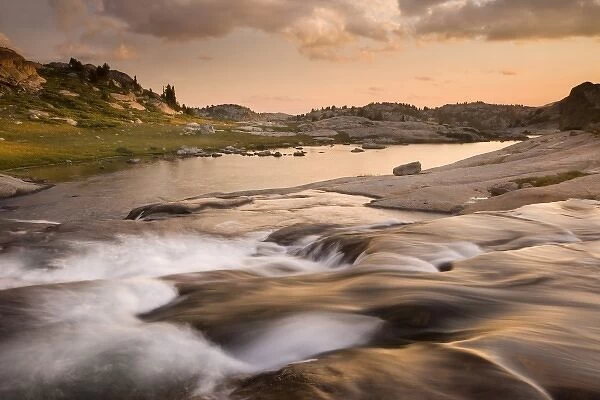 USA, Wyoming, Bridger National Forest, Bridger Wilderness, Wind River Range. Sunset on rapids