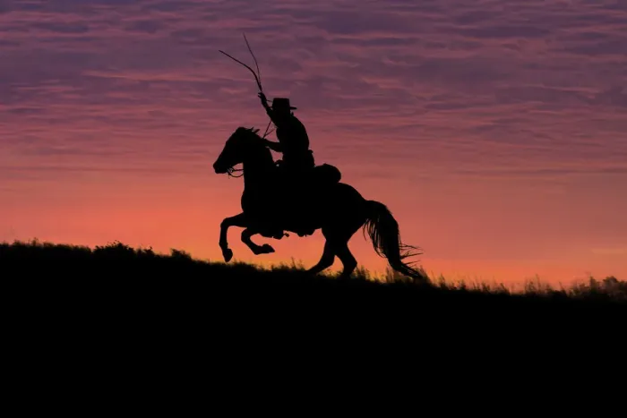 Framed Print : USA, Wyoming, Shell, The Hideout Ranch, Silhouette of Cowboy and Horse at Sunset (MR / PR) Framed Print : USA, Wyoming, Shell, The Hideout Ranch, Silhouette of Cowboy and Horse at Sunset (MR / PR)