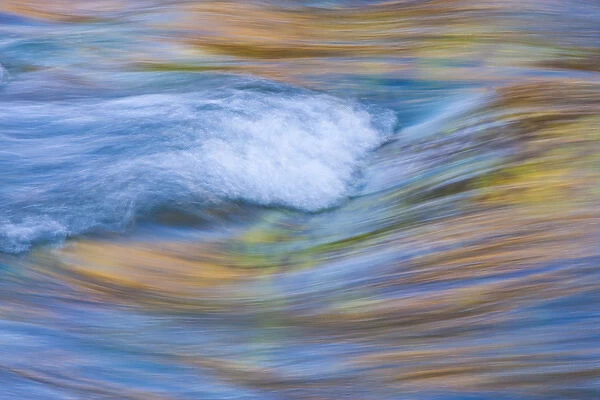 USA, Wyoming, Sublette County, Pine Creek abstract of blurry wave and reflected autumn