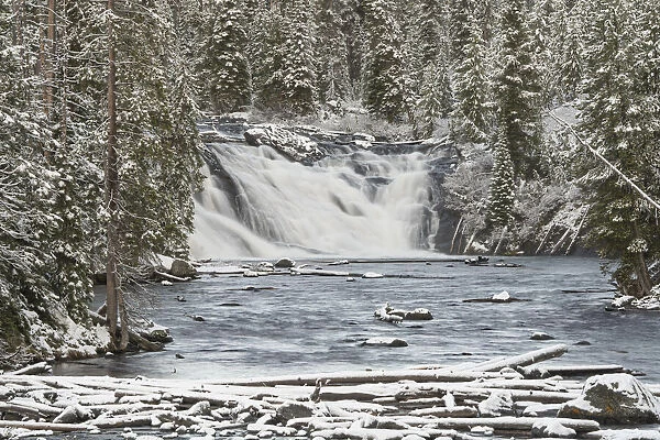 USA, Wyoming, Yellowstone National Park. Snowy landscape with Lewis Falls and Lewis River
