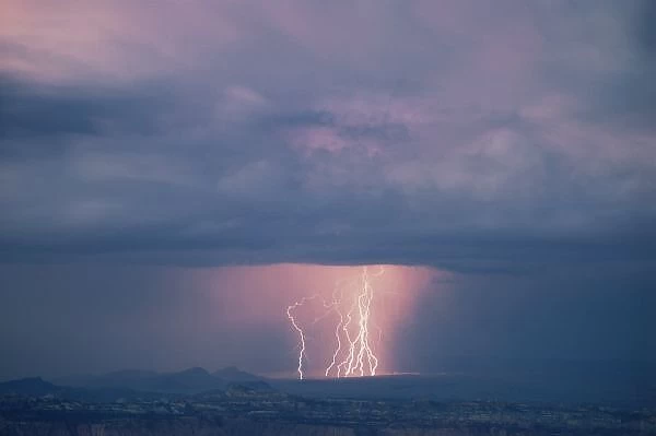 UT, US, Thunderstorm over Cathedral Valley, Capitol Reef NP, dusk, from Boulder Mountain