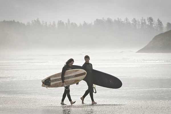 Vancouver Island, Pacific Rim National Park. Surfers on the beach