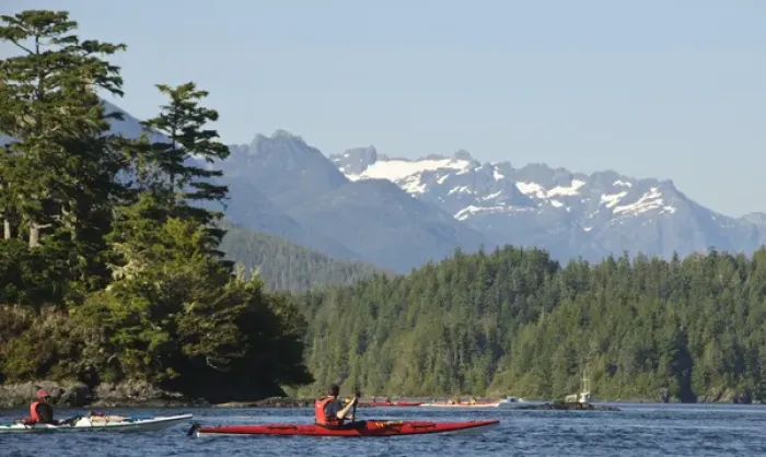 Framed Print : Vancouver Island, Tofino. Sea kayakers with snow covered mountains of Strathcona Framed Print : Vancouver Island, Tofino. Sea kayakers with snow covered mountains of Strathcona