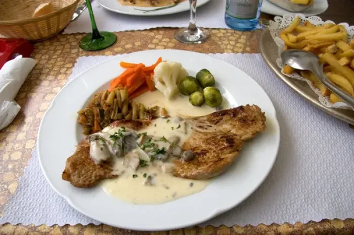 Framed Print : Veal with a cream sauce served at a sidewalk restaurant in Ribeauville, France