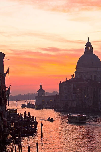 Venice, Italy. Santa Maria della Salute, a water taxi, motor boat, and the Ponte dell Accademia