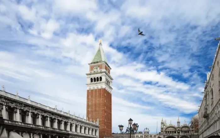 Framed Print : Venice, Veneto, Italy - A bird is flying in the sky above a plaza in a church courtyard Framed Print : Venice, Veneto, Italy - A bird is flying in the sky above a plaza in a church courtyard