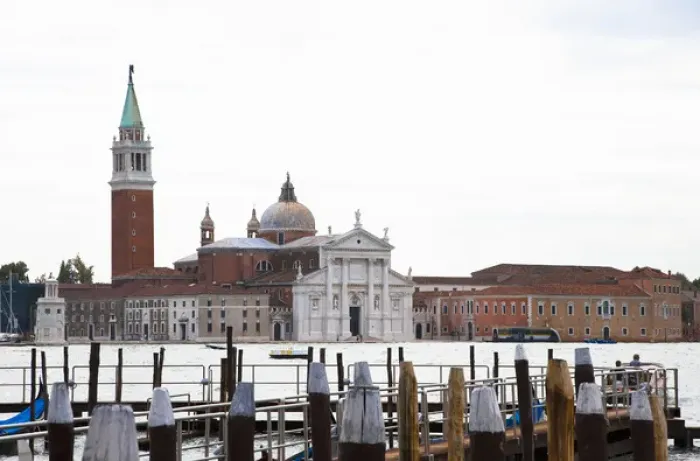 Framed Print : Venice, Veneto, Italy - A church can be seen across the water from a marina dock