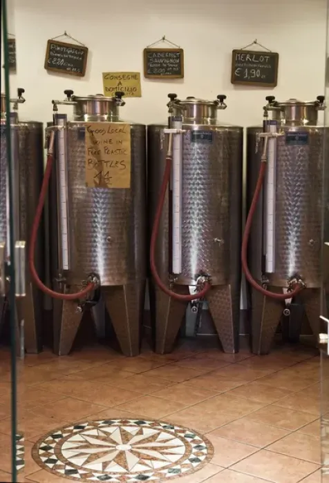 Framed Print : Venice, Veneto, Italy - A row of shiny metal vats containing wine for sale in bulk