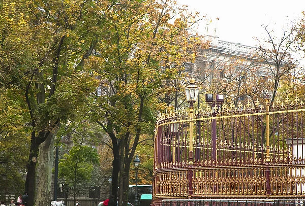 Vienna, Austria - A colorful wrought iron fence surrounded by trees. An old world
