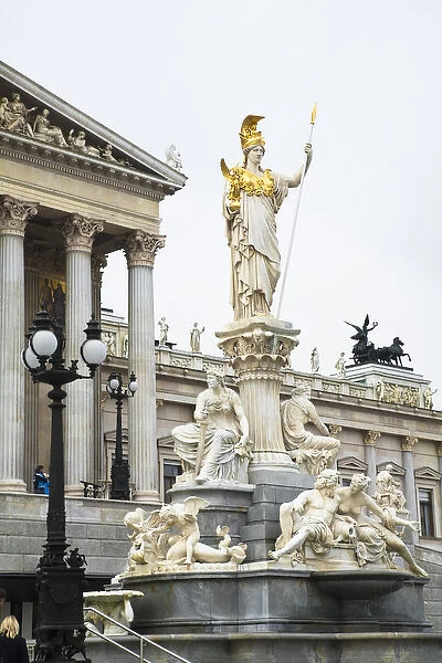 Vienna, Austria - A romanesque statue stands on a dry water feature in front of a