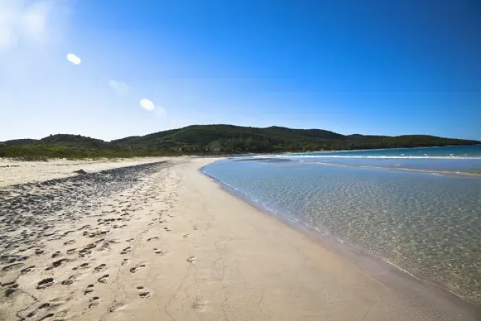 Framed Print : Vieques, Puerto Rico - Gentle waves are rolling up onto the white sands of a tropical beach