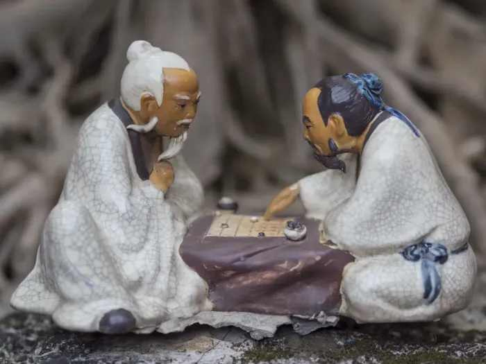 Framed Print : Vietnam, Hanoi. Temple of Literature, painted ceramics of 2 men playing traditional game