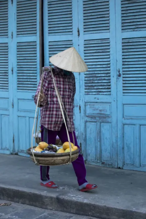 Framed Print : Vietnam. Street vendor with fruit and vegetable basket. Hoi Anh