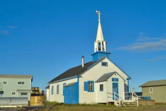 Framed Print : View of a blue and white church in Dene tribe village of Lutsel K e on The Great Slave Lake