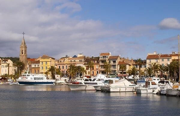 View of the harbour with fishing and leisure boats and sea front buldings Sanary