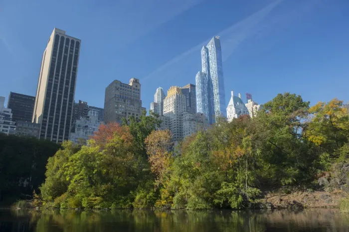 Framed Print : View of highrise buildings along Central Park South from inside Central Park on a sunny Fall day