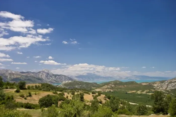 Framed Print : View of Lake Egirdir beyond hilly green land, Isparta, Turkey