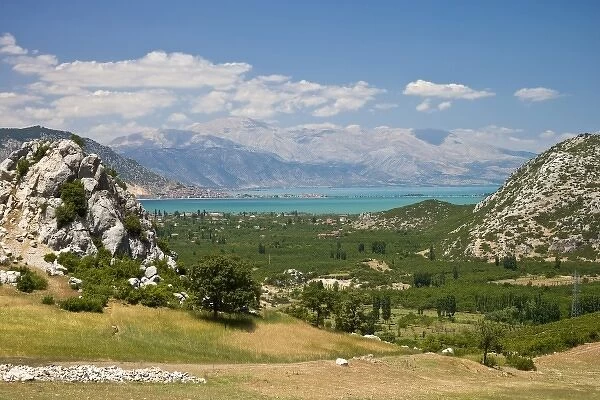 View of Lake Egirdir beyond hilly green land, Isparta, Turkey