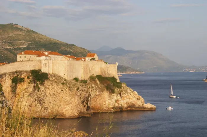 Framed Print : A view of the Lovrijenac Fort and the sea, mountains in the background Dubrovnik, old city