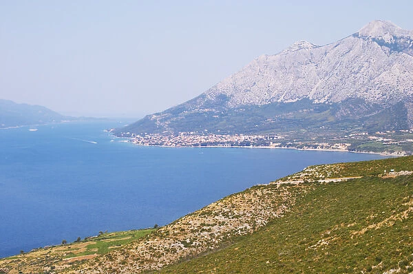 View over the Orebic village town and the Sveti Ilija mountain, dark blue sea towards