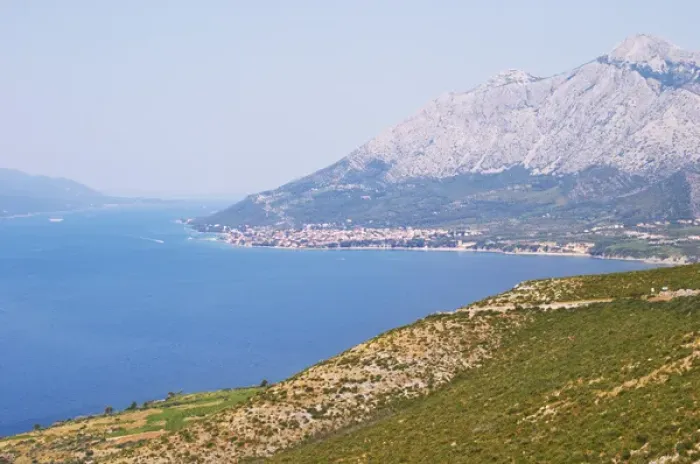 Framed Print : View over the Orebic village town and the Sveti Ilija mountain, dark blue sea towards Framed Print : View over the Orebic village town and the Sveti Ilija mountain, dark blue sea towards