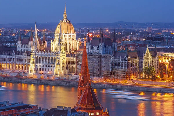 View of Parliament Buildings along Danube River at dusk, Budapest, Capital of Hungary
