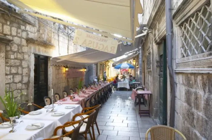 Framed Print : View the Prijeko street with restaurants with outside seating long tables and chairs