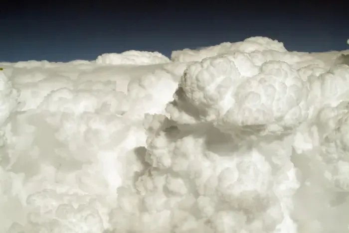 Framed Print : View of puffy, white clouds from an airplane