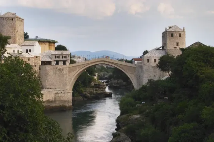 Framed Print : View along the river of the old reconstructed bridge. Historic town of Mostar. Federation Framed Print : View along the river of the old reconstructed bridge. Historic town of Mostar. Federation