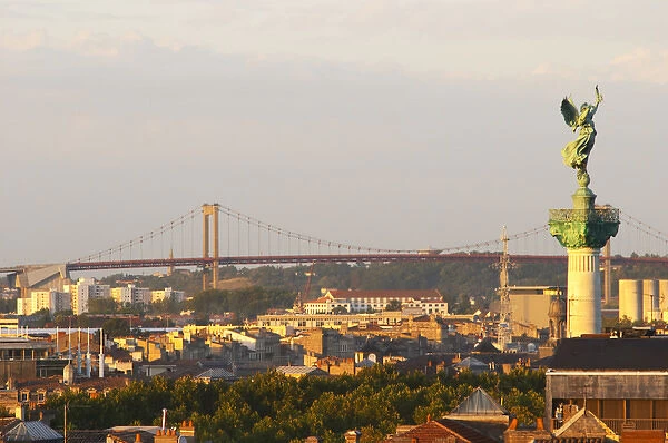 A view over the rooftops and city of Bordeaux with the Pont d Aquitaine over
