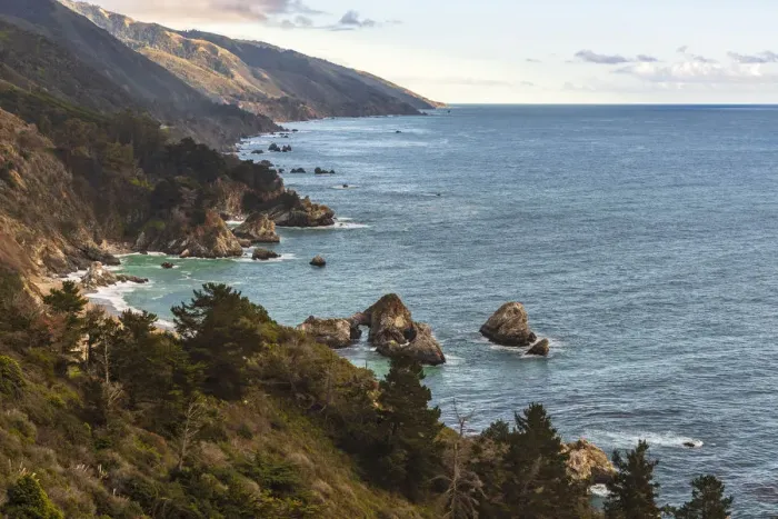 Framed Print : View south of Big Sur coastline with little arch rock in Ocean waters