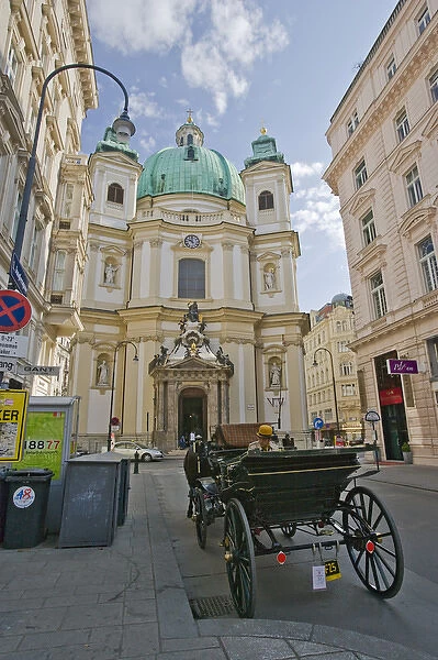 A view down a street in Viennia Austria looking at St. Peters Church