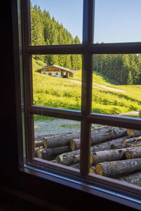 Framed Print : View out a window toward a cabin nestled in the hills of the Austrian Alps Framed Print : View out a window toward a cabin nestled in the hills of the Austrian Alps
