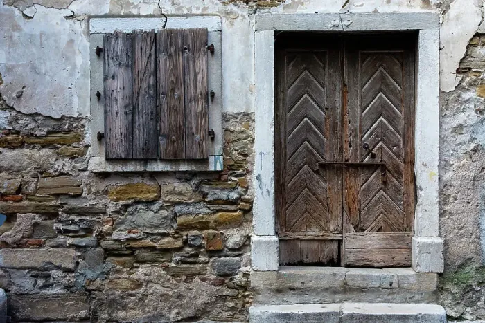 Framed Print : A view of a wooden door and shuttered window. Isola, Slovenia