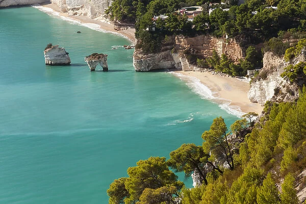 View of Zagare Bay and two sea stacks, Gargano Promontory, Apulia, Italy