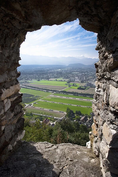 Villach, Carinthia, Austria - A rural landscape as seen from the remnants of an old stone window