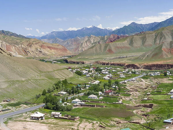 Village at the Pamir Highway. The mountain range Tian Shan or Heavenly Mountains