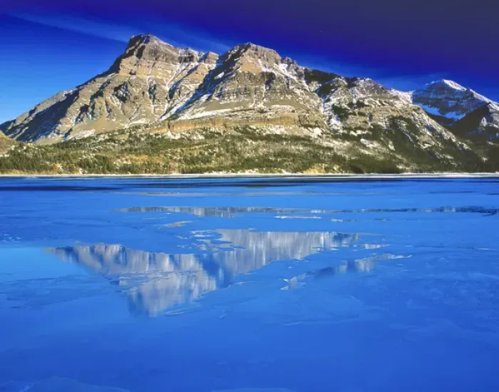 Framed Print : Vimy Peak reflects into Waterton Lake in winter in Waterton Lakes National Park in Framed Print : Vimy Peak reflects into Waterton Lake in winter in Waterton Lakes National Park in
