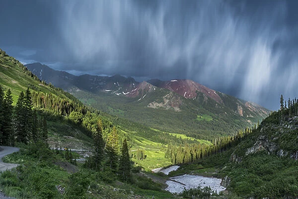 Virga and storm moving over mountains in Colorado