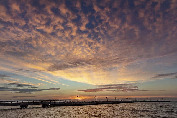 Vivid sunrise clouds over the Atlantic Ocean from Higgs Beach Pier in Key West, Florida