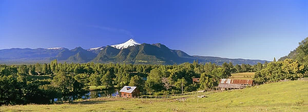 Volcan Villarrica (2814m) with farm Villarica National Park, Region Araucania, Chile